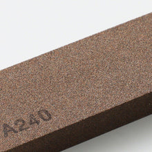 Load image into Gallery viewer, close up on the grit of the whestone
