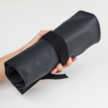 Load image into Gallery viewer, Rolled up roll case in hand