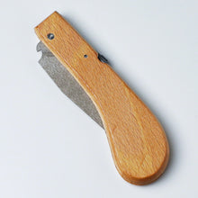Load image into Gallery viewer, holding saw with the blade closed
