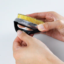 Load image into Gallery viewer, hand removing the rubber gasket from the dense kenzan
