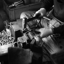 Load image into Gallery viewer, Artisan shaping the blades with a hammer

